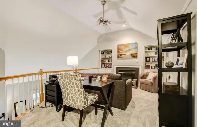 a view of a livingroom with furniture and a fireplace