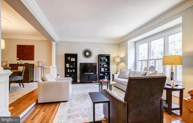 a living room with fireplace furniture and a flat screen tv