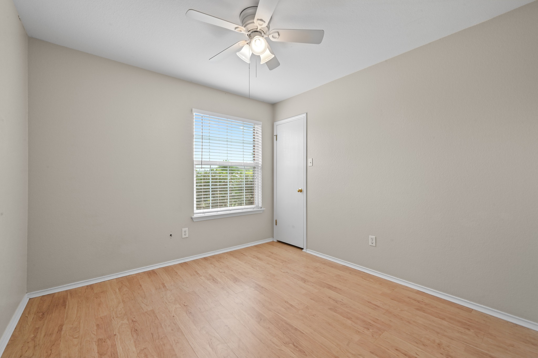 112 Mason Reed Cove Kyle, TX 78640 - Photo 19 of 26 wooden floor in an empty room with a window