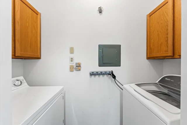 a room with a sink and a washer dryer