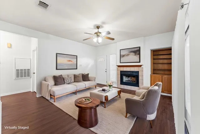 a living room with furniture and a fireplace