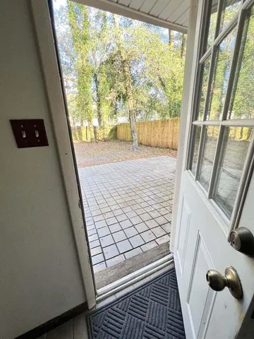 a view of an empty room and window