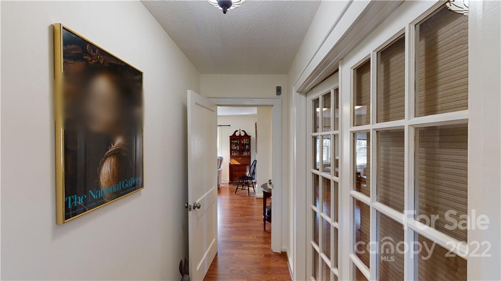 141 Wallaby Road Cherryville, NC 28021 - Photo 13 of 47 a view of a hallway with wooden floor and windows