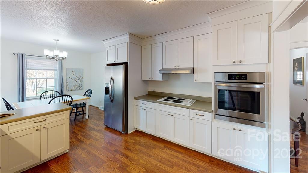 141 Wallaby Road Cherryville, NC 28021 - Photo 18 of 47 a kitchen with white cabinets and stainless steel appliances