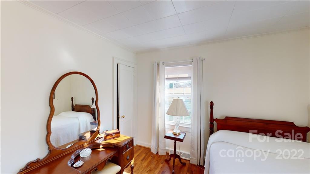 141 Wallaby Road Cherryville, NC 28021 - Photo 22 of 47 a bedroom with a bed and a wooden floor