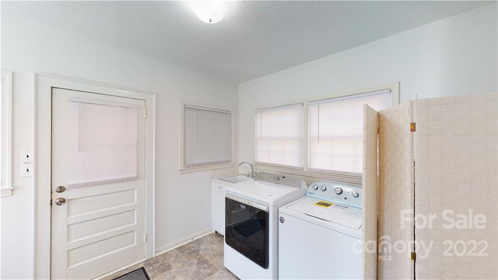 141 Wallaby Road Cherryville, NC 28021 - Photo 28 of 47 a view of washer and dryer with bathroom in the background
