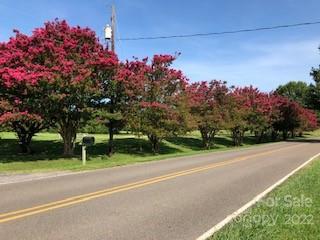 141 Wallaby Road Cherryville, NC 28021 - Photo 34 of 47 a front view of a house with a big yard and a large tree