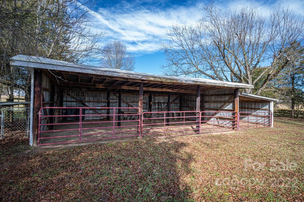 141 Wallaby Road Cherryville, NC 28021 - Photo 9 of 47 a view of house with backyard and wooden fence