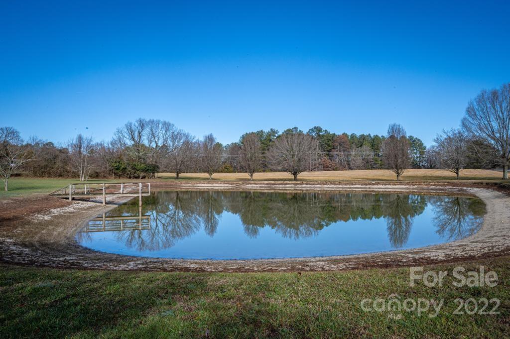 141 Wallaby Road Cherryville, NC 28021 - Photo 10 of 47 a view of a lake with a yard