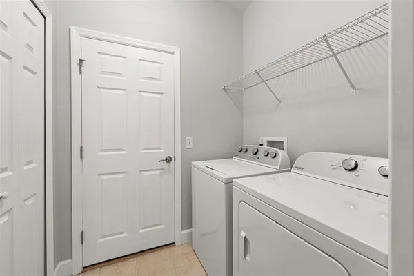 a view of storage and utility room with washer and dryer