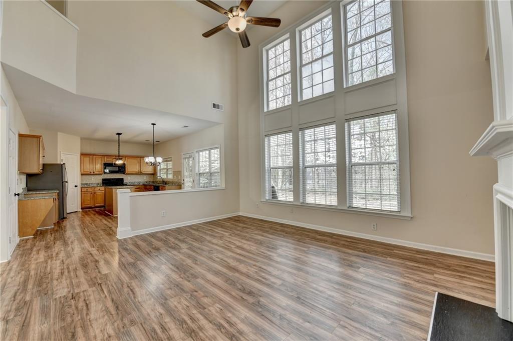 100 Hawnley Trc Northwest Suwanee, GA 30024 - Photo 14 of 58 a view of kitchen and hall with wooden floor