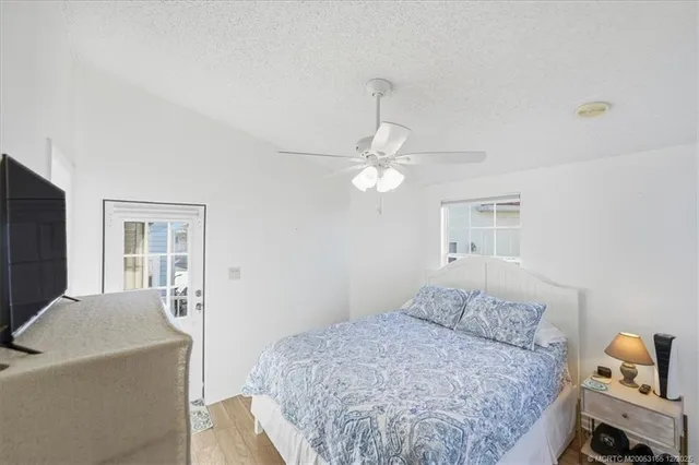 a bathroom with a bathtub sink vanity and mirror