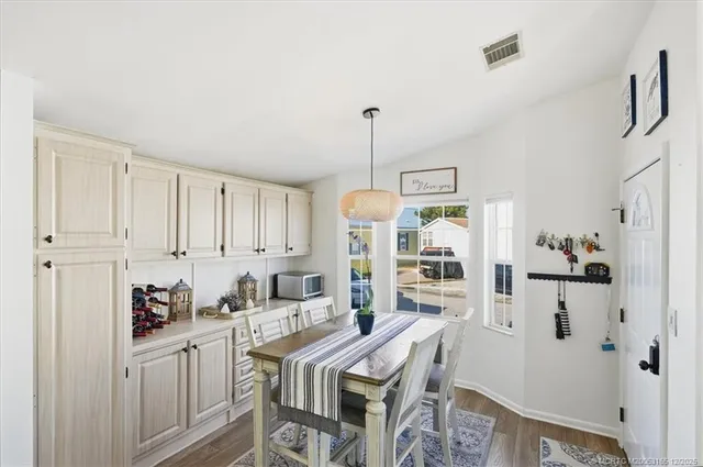 a kitchen with stainless steel appliances granite countertop a stove refrigerator and a sink