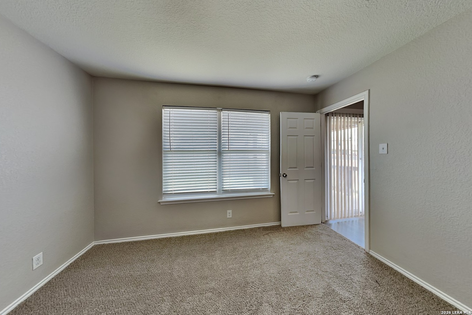 6510 Poseidon Way Converse, TX 78109 - Photo 7 of 16 a view of an empty room with a window
