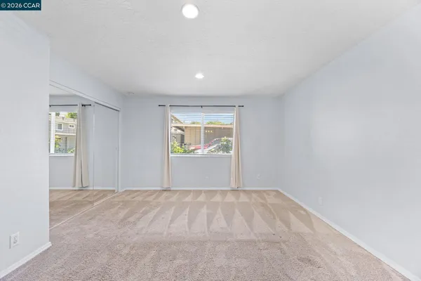 a view of an empty room with a window