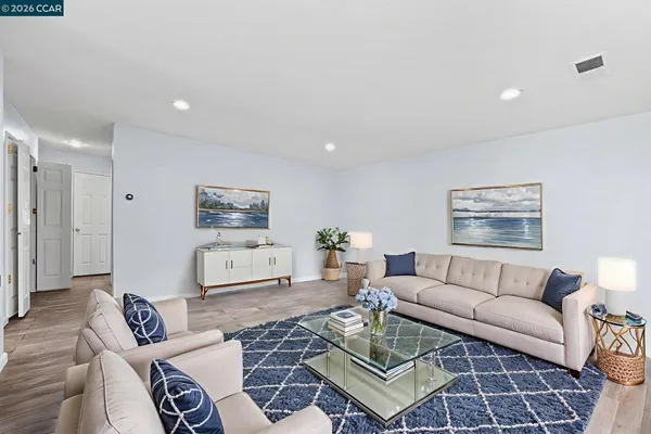 a living room with furniture a rug and a couch