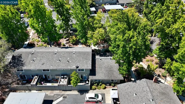 an aerial view of a house with a yard