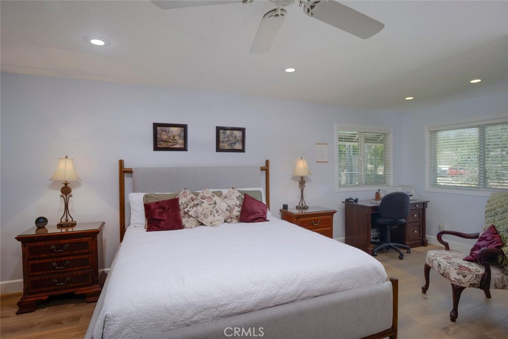 10424 Cartilla Court Rancho Cucamonga, CA 91737 - Photo 14 of 36 a bedroom with a bed and wooden floor