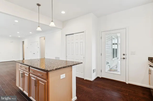 a kitchen that has a lot of cabinets in it
