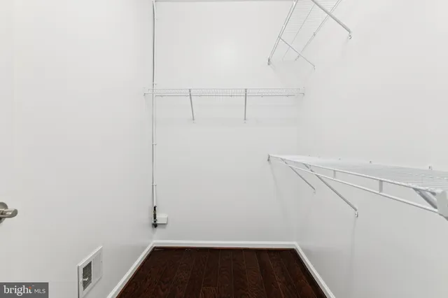 a view of storage and utility room with racks on the wall