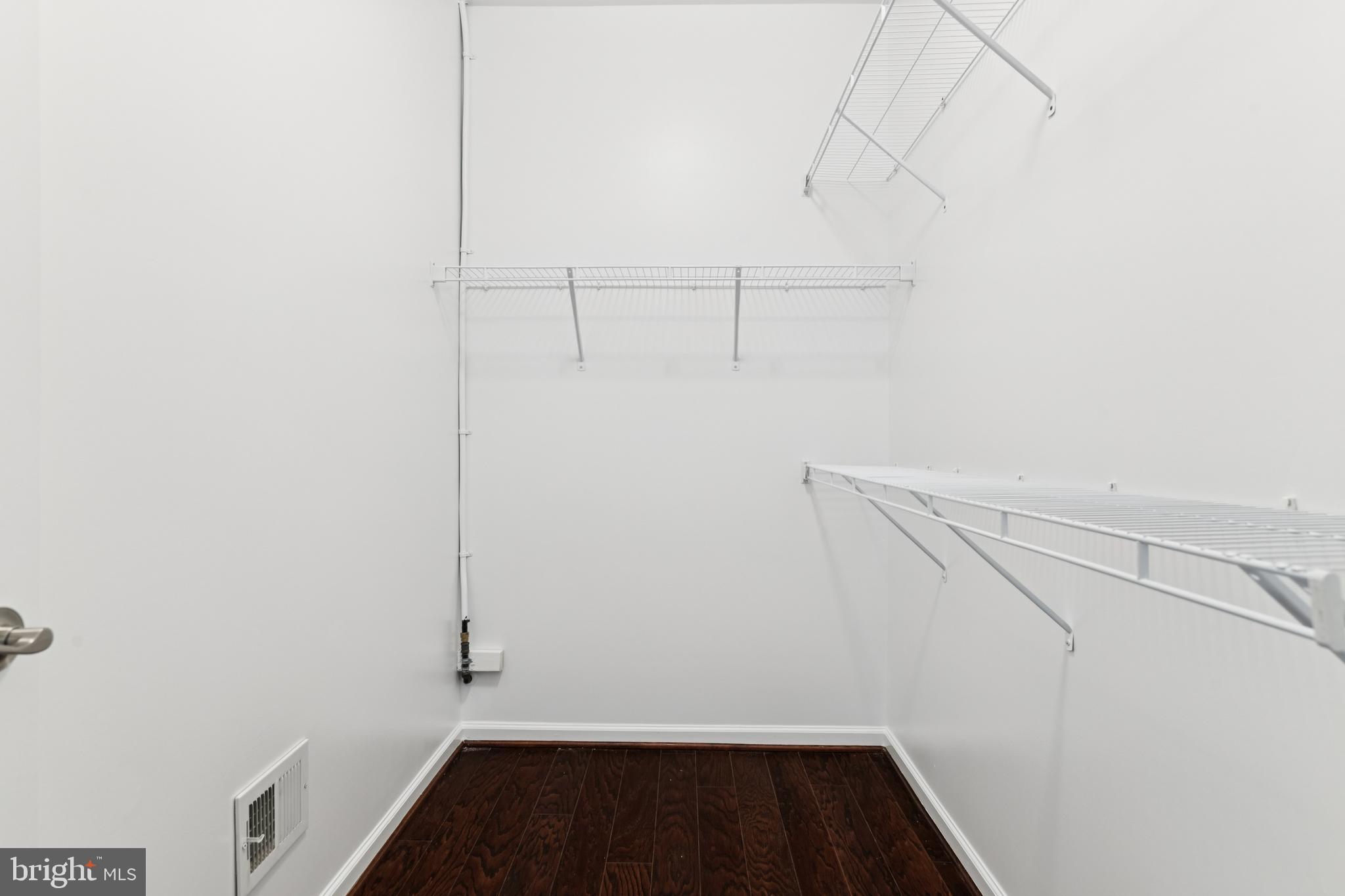 15 Point Bluff Street Fredericksburg, VA 22406 - Photo 14 of 25 a view of storage and utility room with racks on the wall