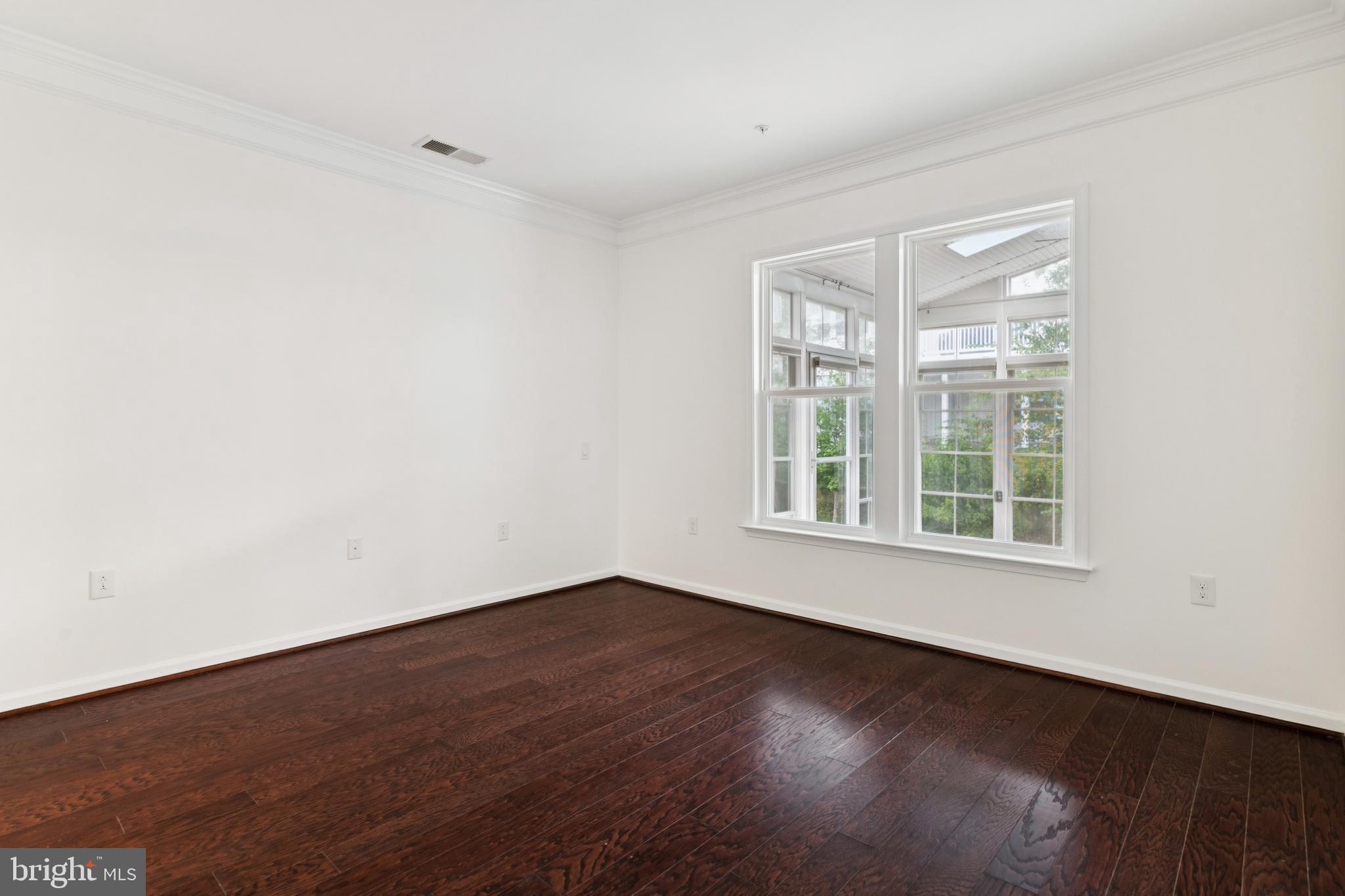 15 Point Bluff Street Fredericksburg, VA 22406 - Photo 15 of 25 an empty room with wooden floor and windows