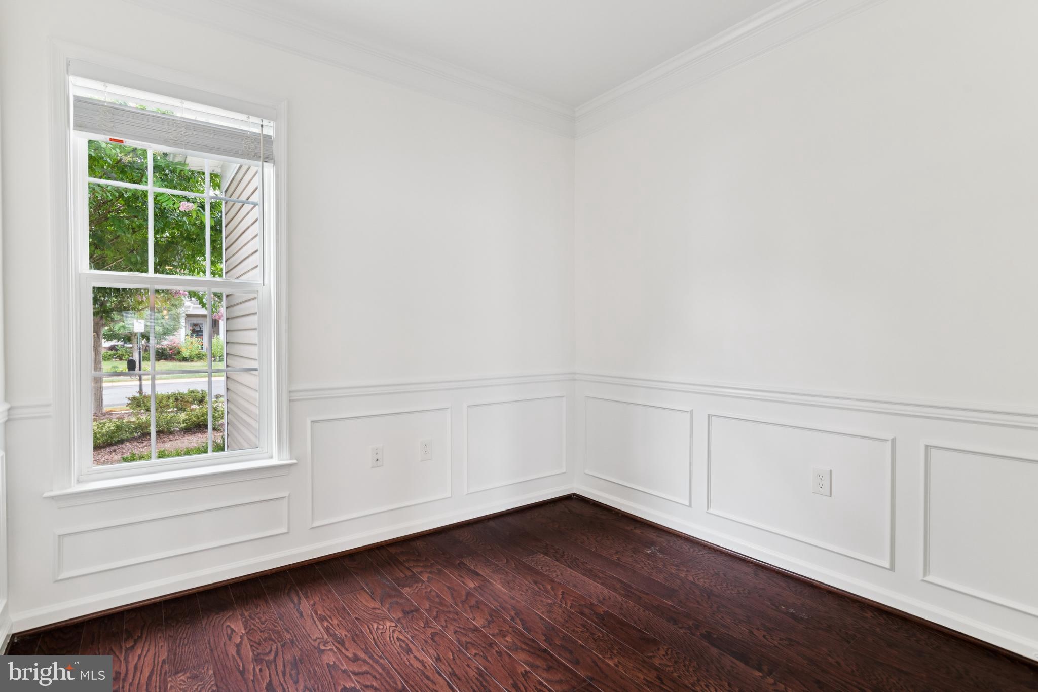 15 Point Bluff Street Fredericksburg, VA 22406 - Photo 5 of 25 a view of an empty room with wooden floor and a window