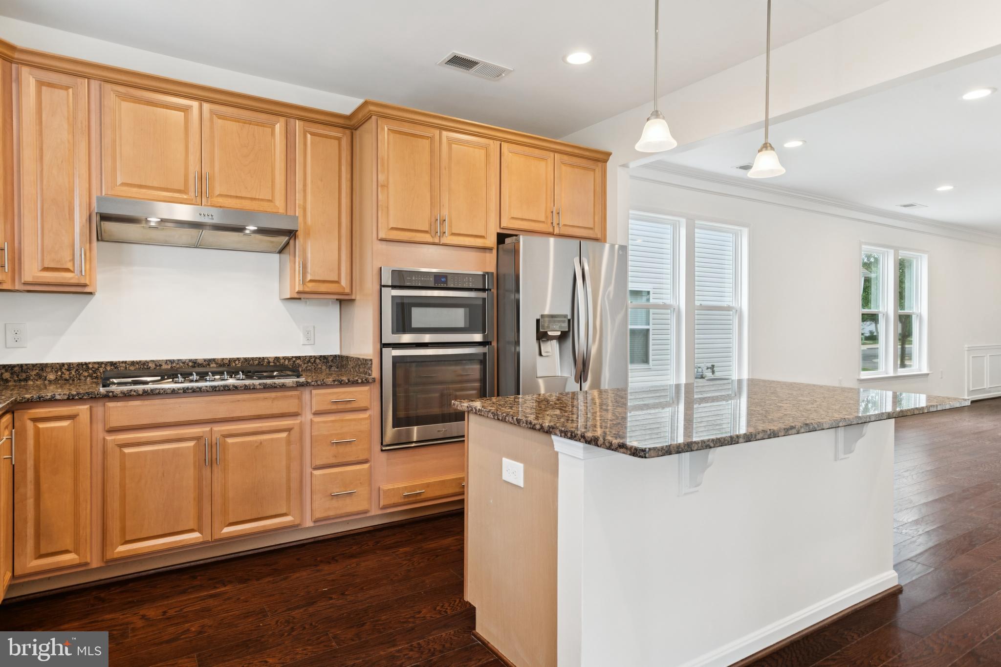 15 Point Bluff Street Fredericksburg, VA 22406 - Photo 10 of 25 a kitchen with stainless steel appliances granite countertop a refrigerator and a stove top oven