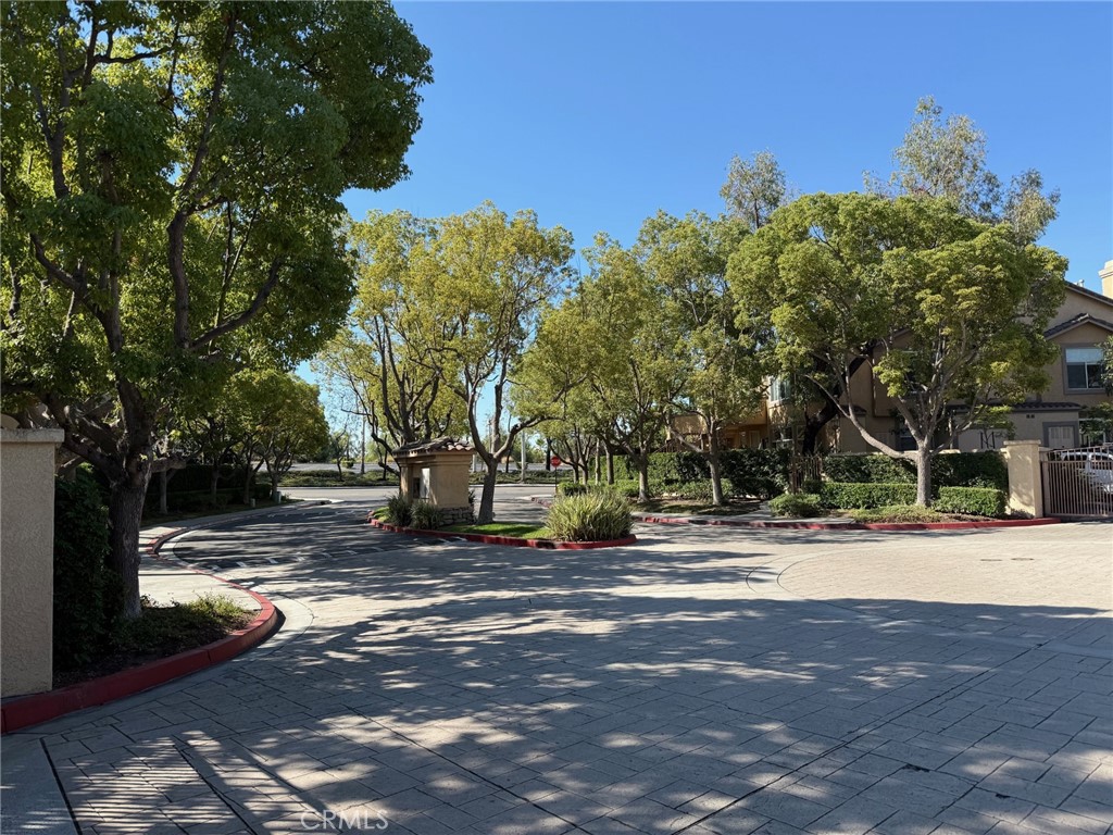 19431 Rue De Valore, Unit 14A Lake Forest, CA 92610 - Photo 26 of 26 a view of a tree in front of a house