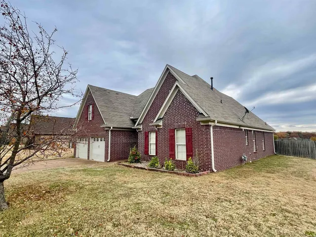 front view of a house with a yard