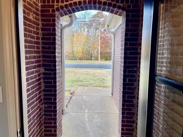 a view of a room that has a large window