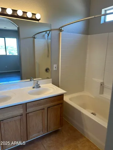 a bathroom with a sink and a bathtub