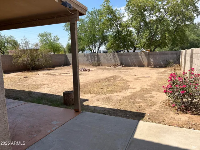 a view of a backyard of the house