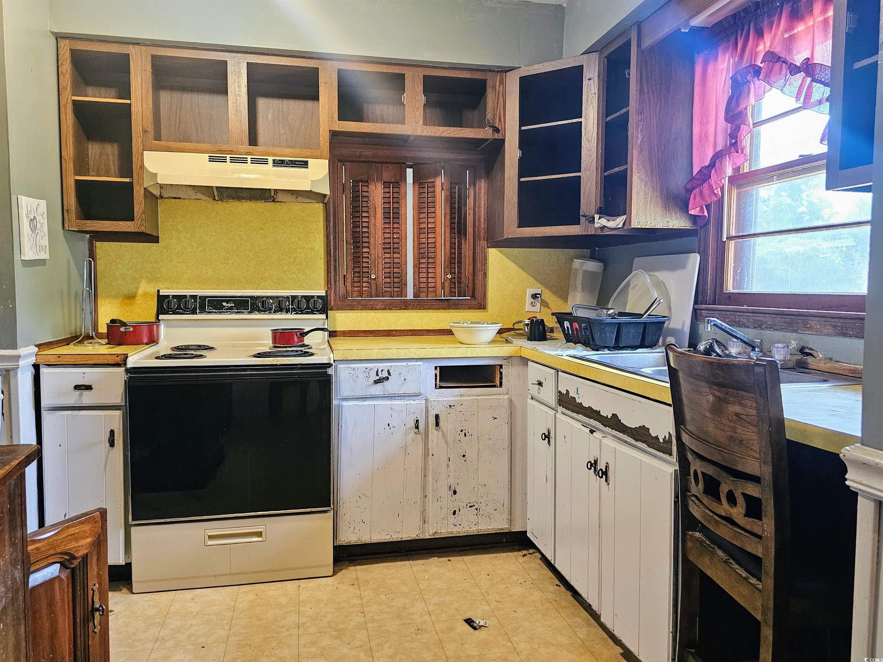 156 Small Road Sellers, SC 29592 - Photo 8 of 32 Kitchen with white cabinets, premium range hood, w