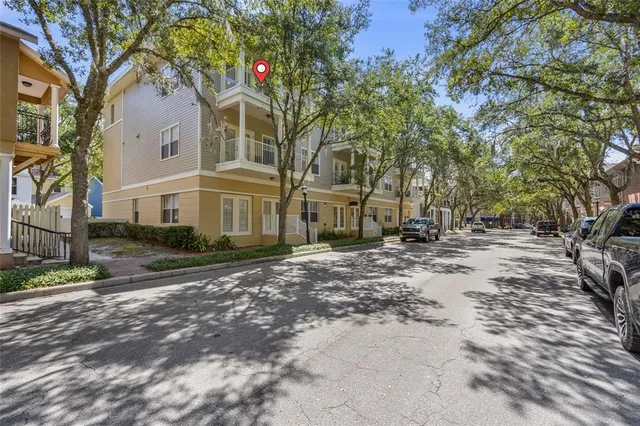 a view of a large building with large trees
