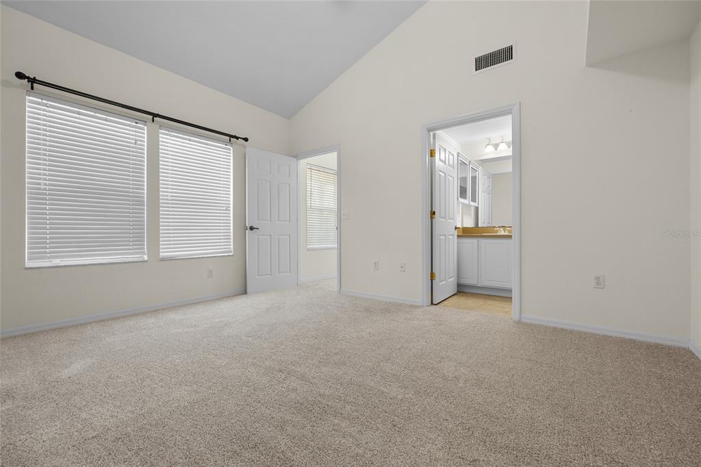 4941 Southwest 91 Terrace, Unit N301 Gainesville, FL 32608 - Photo 14 of 22 an empty room with windows and closet