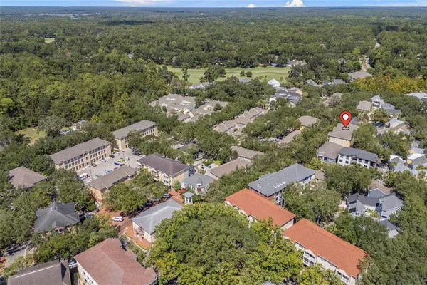 an aerial view of residential houses with outdoor space