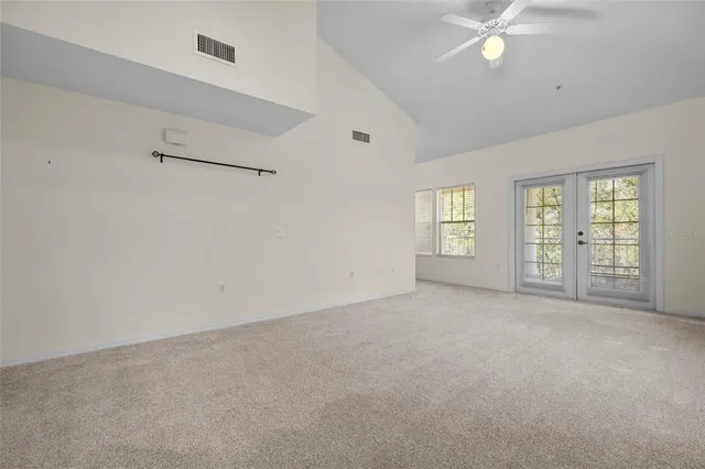 a view of an empty room with a window