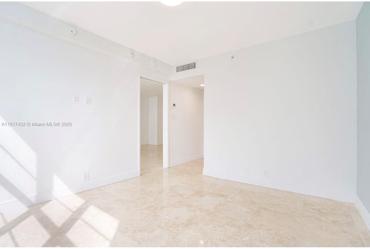 5101 Collins Avenue, Unit 14J Miami Beach, FL 33140 - Photo 4 of 10 a view of an empty room