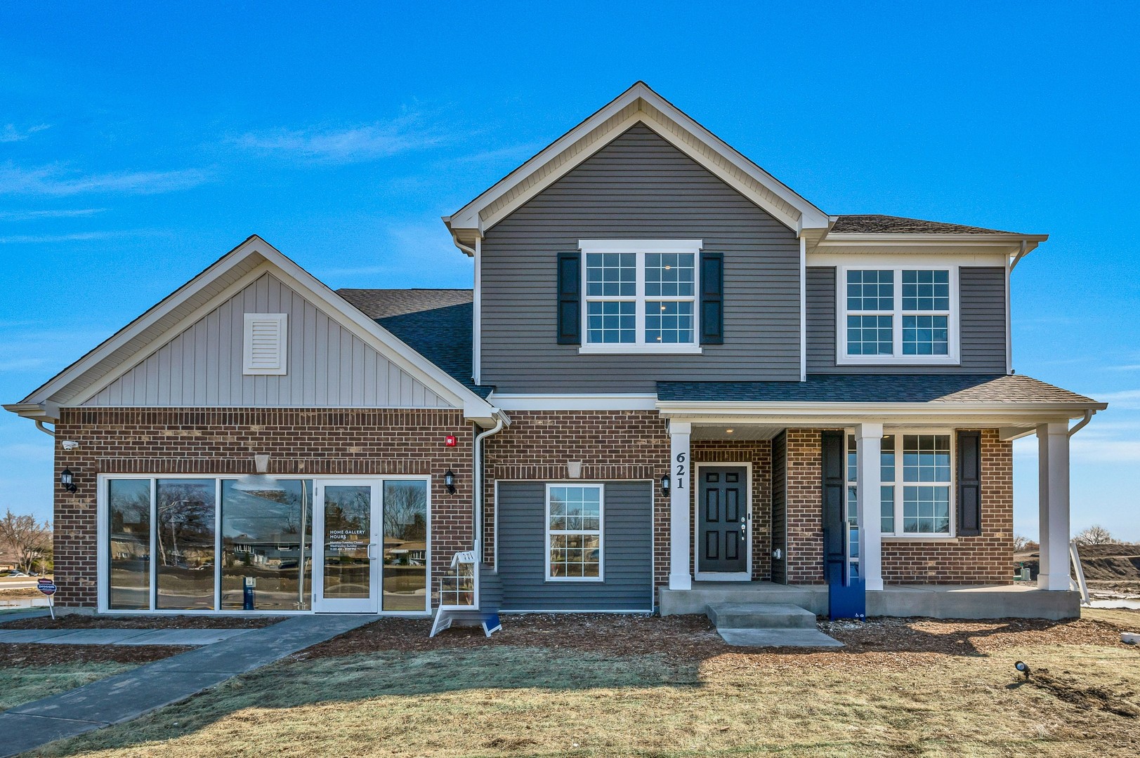 front view of a house with a yard
