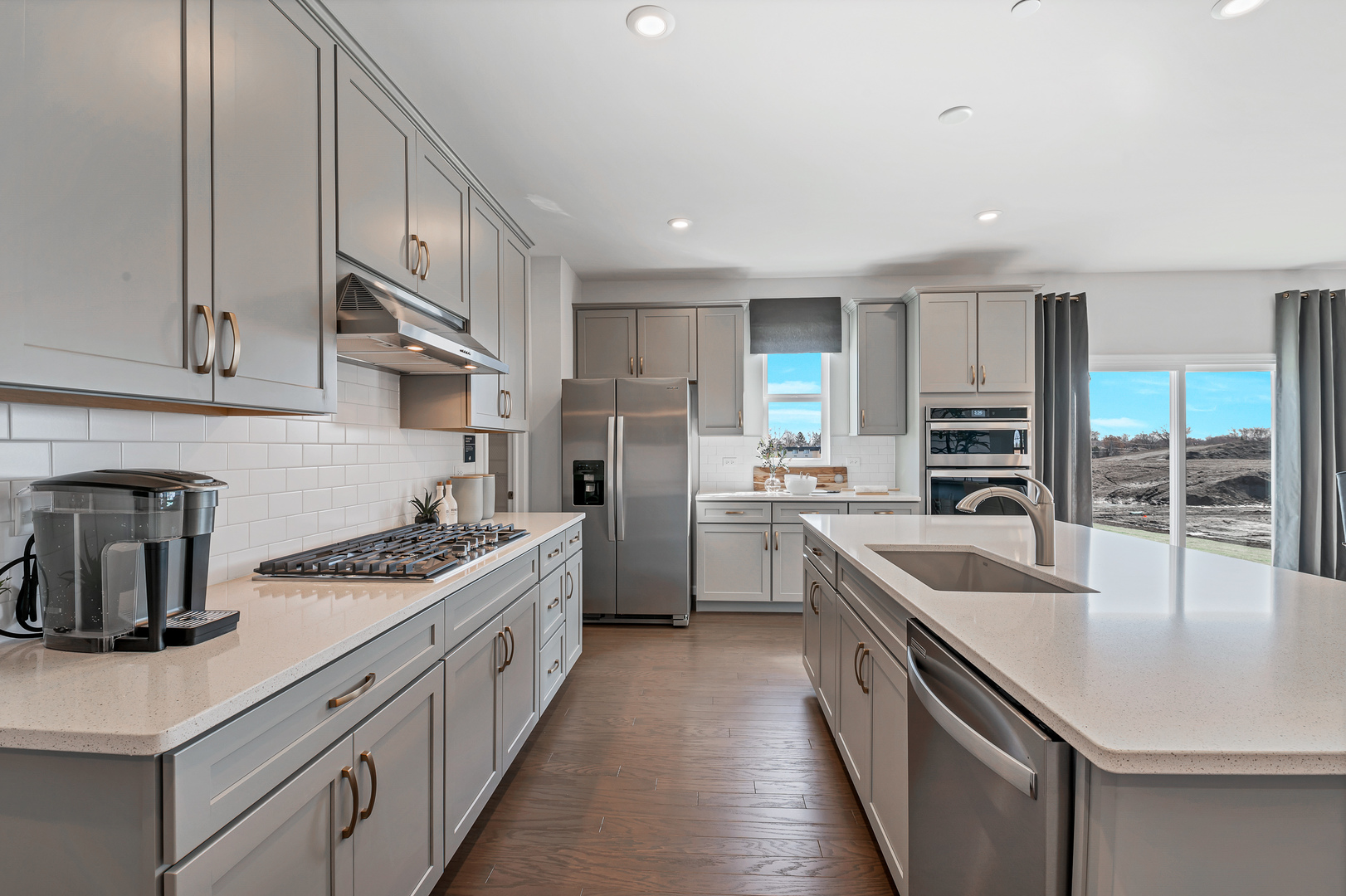 621 North Sullivan Street Addison, IL 60101 - Photo 11 of 22 a kitchen with stainless steel appliances granite countertop a sink stove and refrigerator