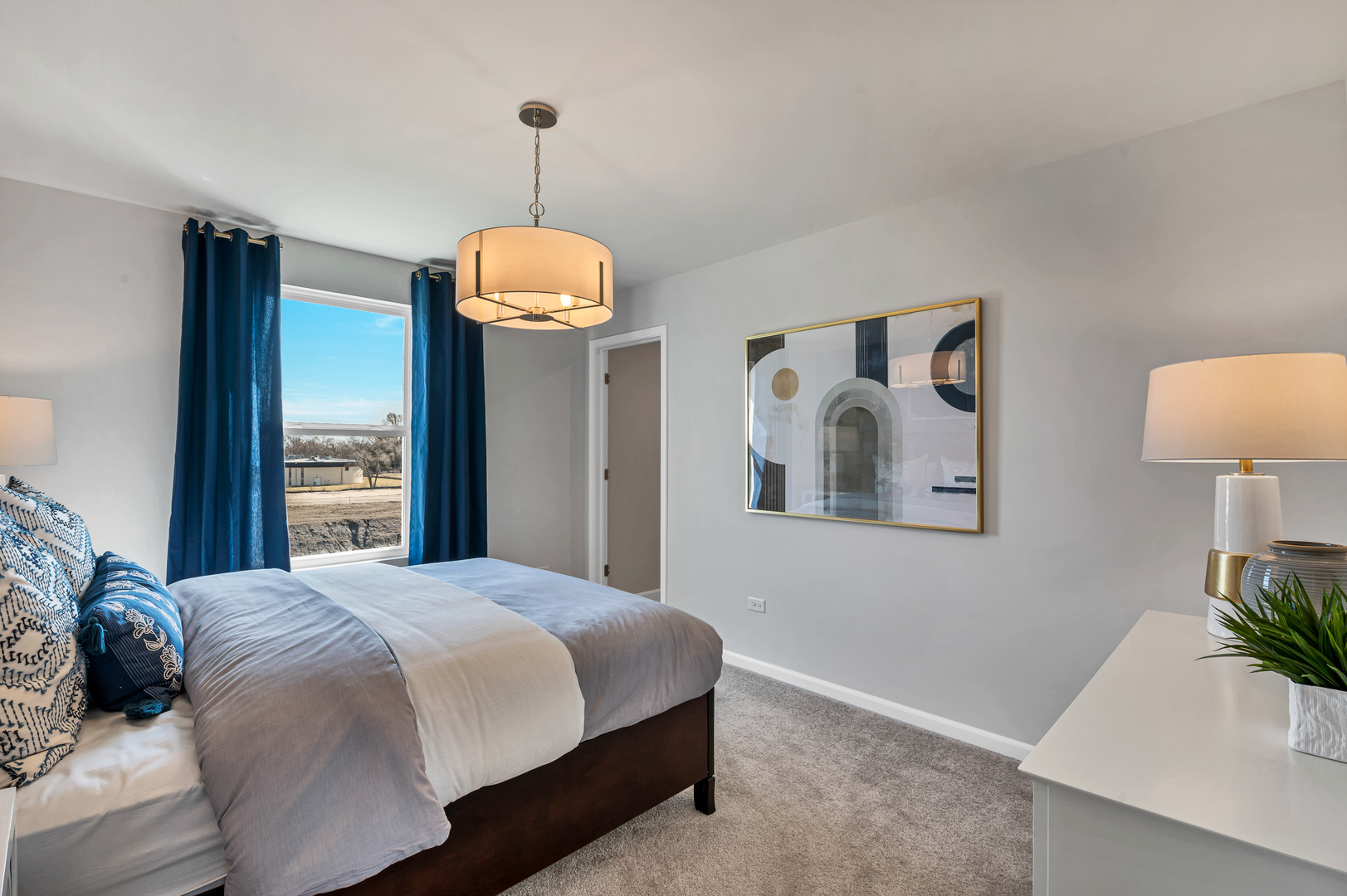 621 North Sullivan Street Addison, IL 60101 - Photo 18 of 22 a bedroom with a bed and a potted plant