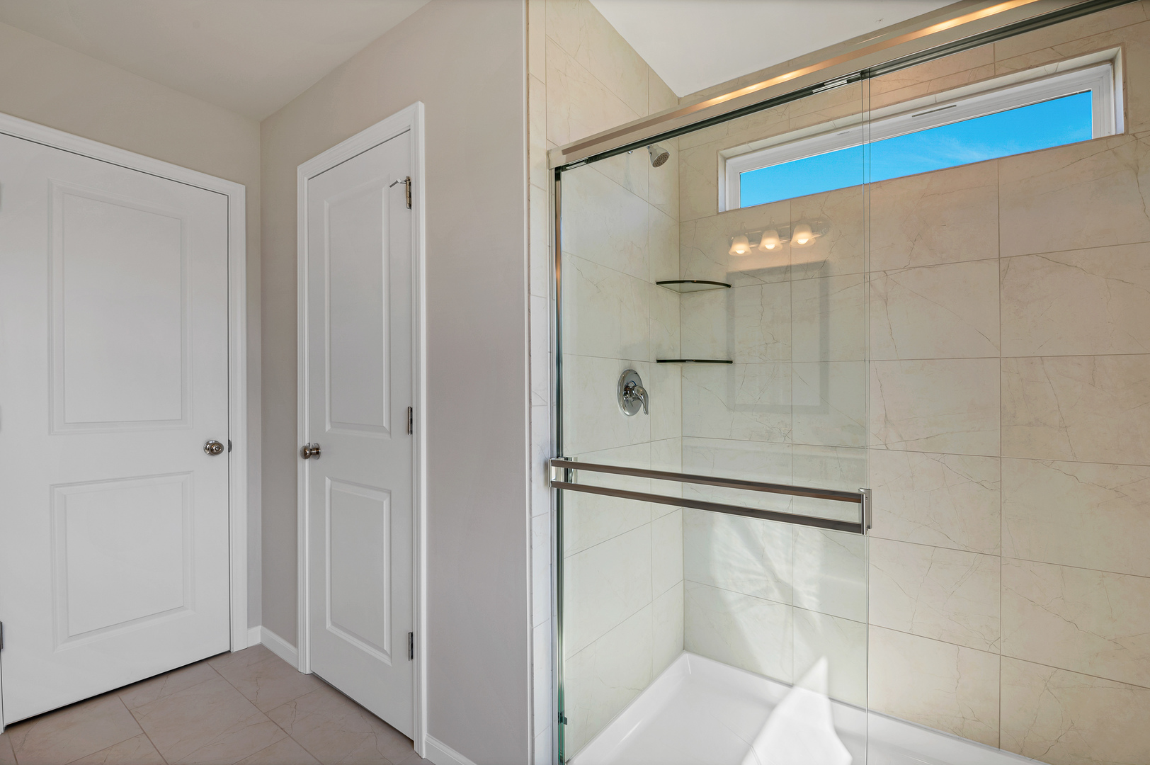 621 North Sullivan Street Addison, IL 60101 - Photo 22 of 22 a bathroom with a shower and a glass door