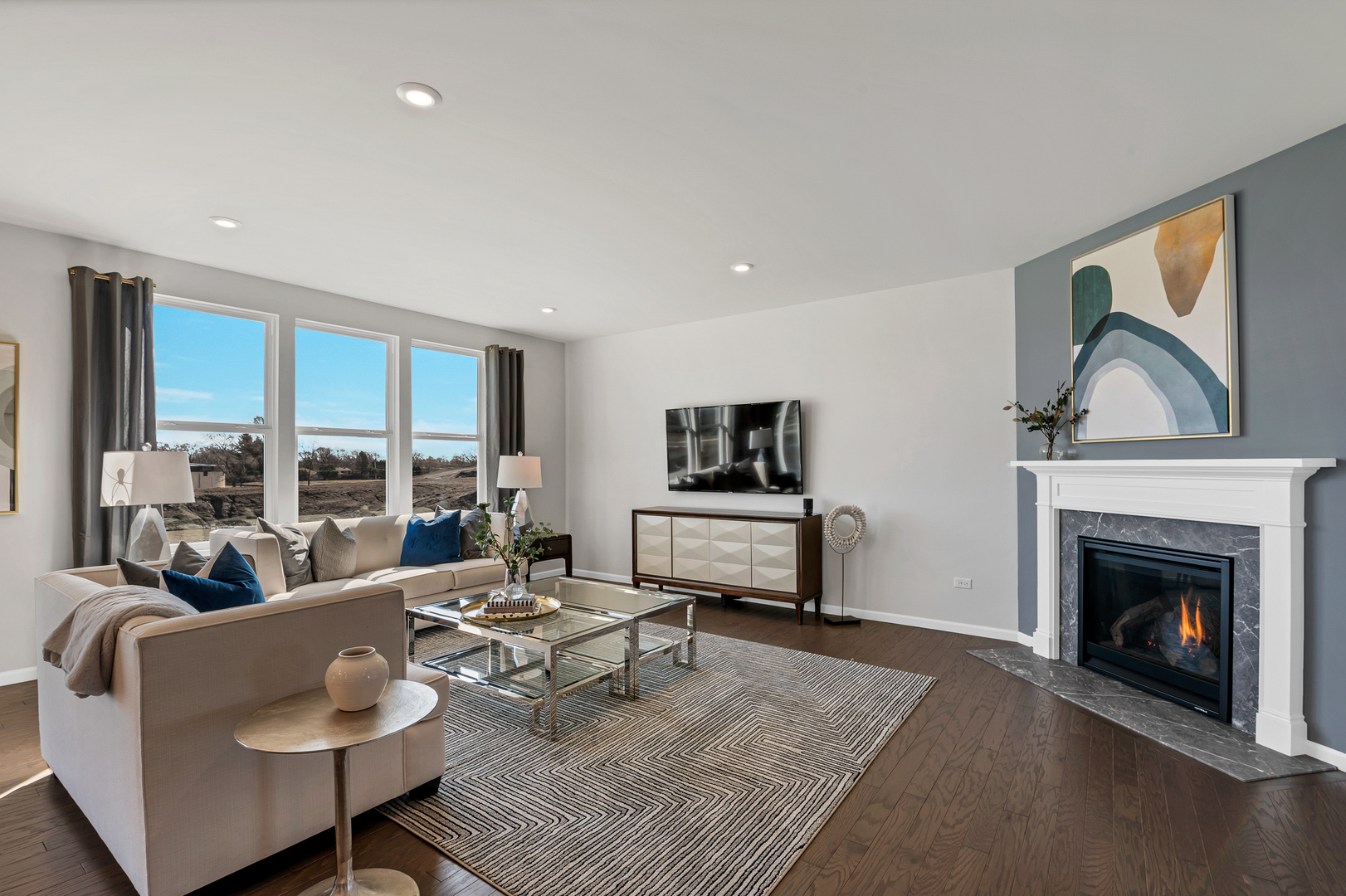 621 North Sullivan Street Addison, IL 60101 - Photo 7 of 22 a living room with furniture a fireplace and a flat screen tv