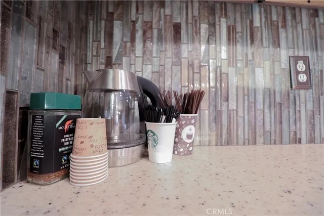 a kitchen with a sink and wooden cabinets