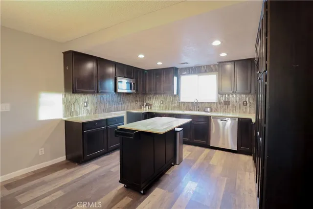 a bathroom with a sink mirror vanity and toilet