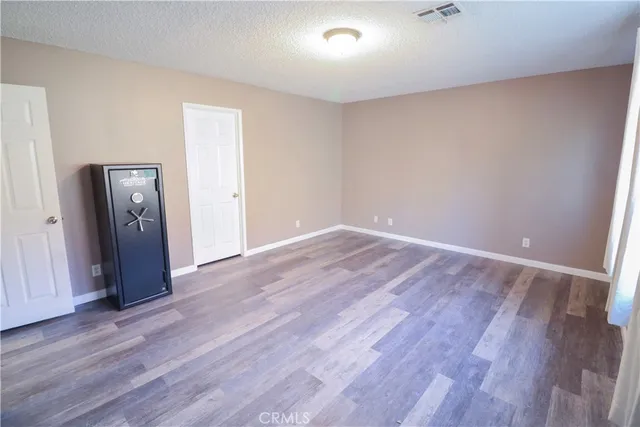 a bathroom with a double vanity sink a mirror and a bathtub
