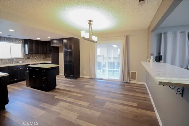 a kitchen with a sink and a refrigerator