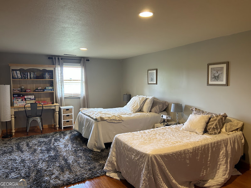 2838 Skitts Mountain Road Cleveland, GA 30528 - Photo 16 of 41 a bedroom with two beds and a desk