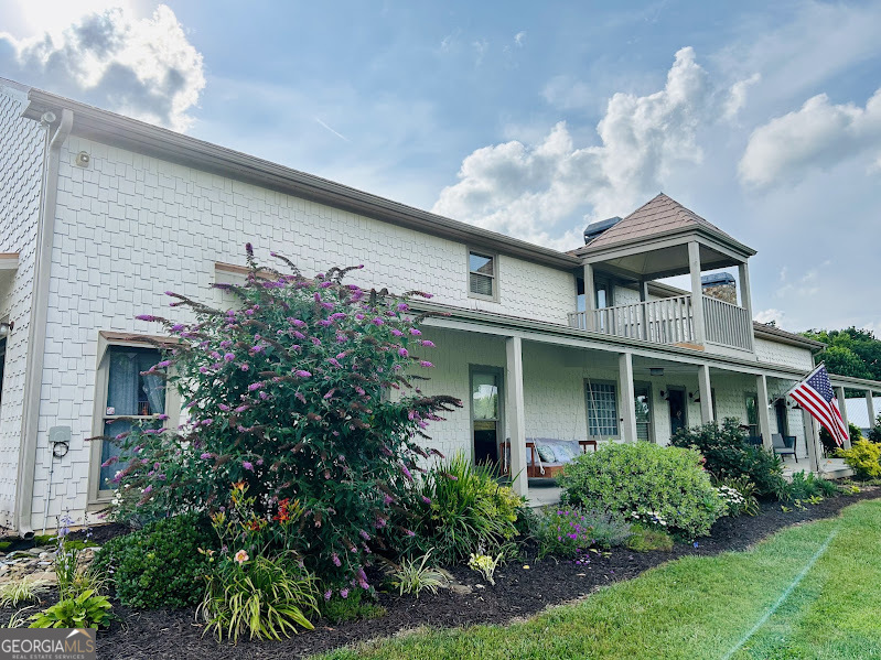 2838 Skitts Mountain Road Cleveland, GA 30528 - Photo 2 of 41 a front view of a house with plants